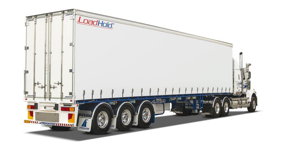 White Freighter Loadhold trailer shown on truck driving on white background