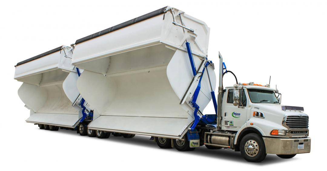 AZMEB high volume side tipper trailer with tipping shown on white truck on white background
