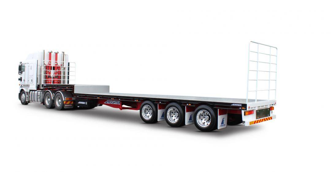 Freighter Dropdeck Semi trailer shown on truck driving on a white background