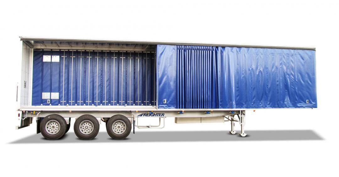 Freighter-SafeT-liner trailer with blue curtains shown alone on white background