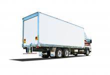 Classic Peki trailer on truck driving on a white background